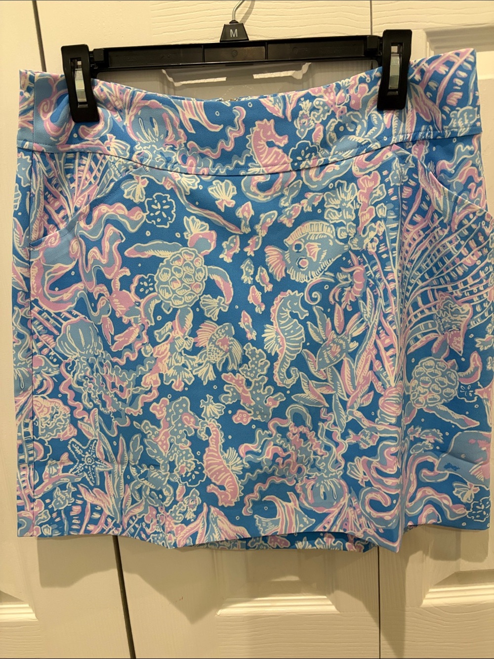 Lilly Pulitzer Blue Tropical Print Skort with side pockets and attached shorts.